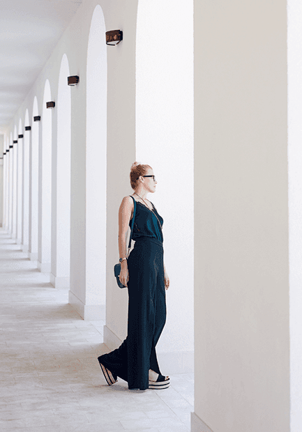 Woman in a white hallway